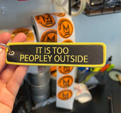 handmade keychain product shot — It is too peopley outside keychain