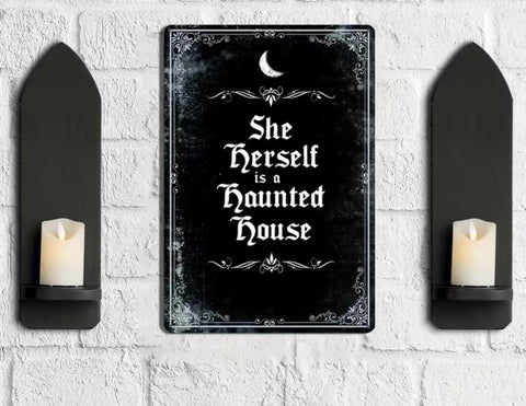 She herself is a haunted House Sign